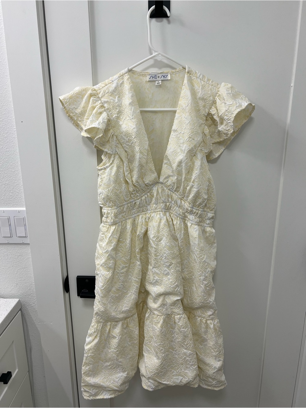 She + Sky Cream Textured V-Neck Tiered Dress
